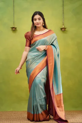 Embrocation Firozi Soft Banarasi Silk Saree With Ephemeral Blouse Piece